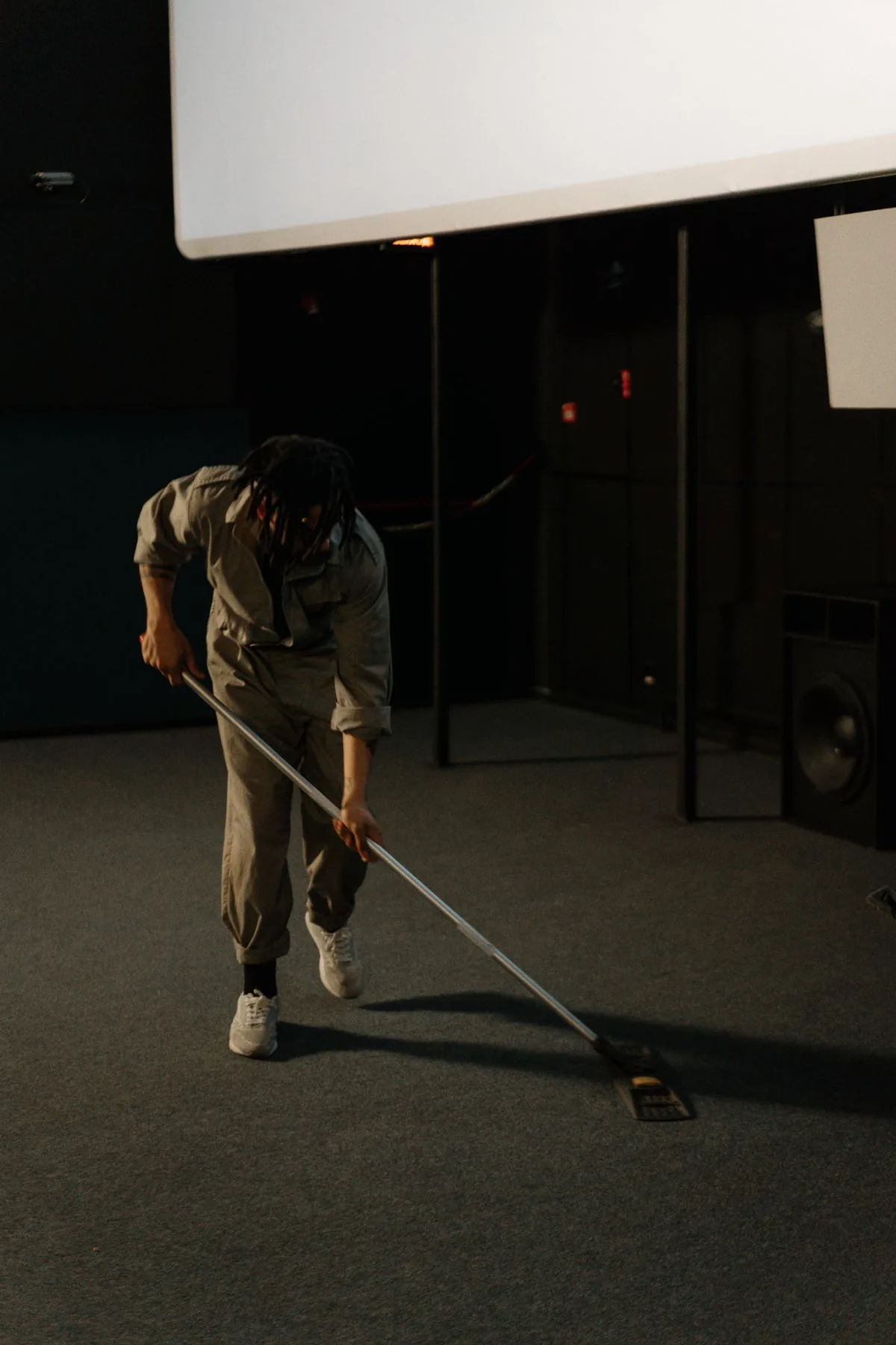 Crew member cleaning a large commercial floor